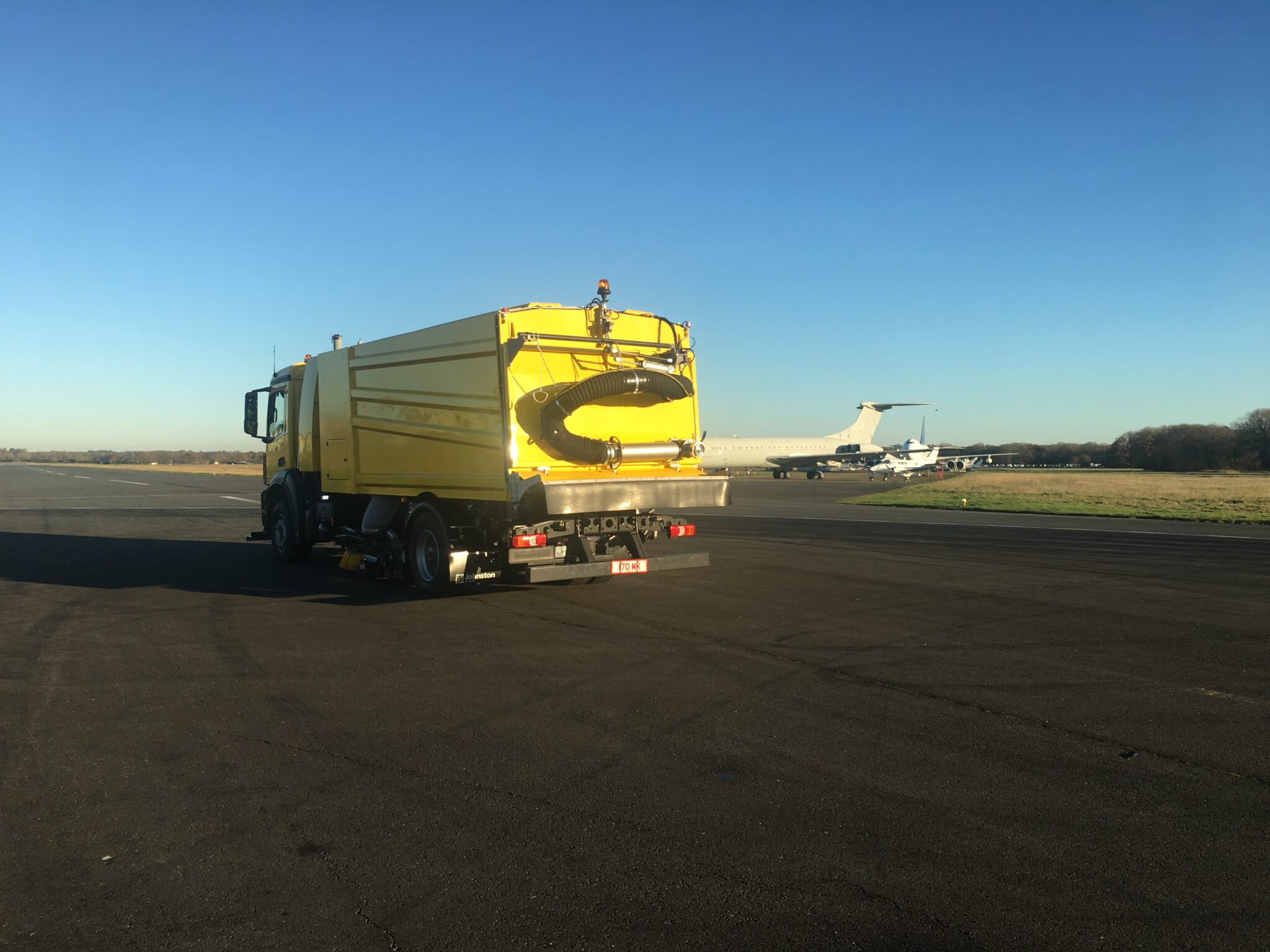 V95t aero airport sweeper on airport from 45 back